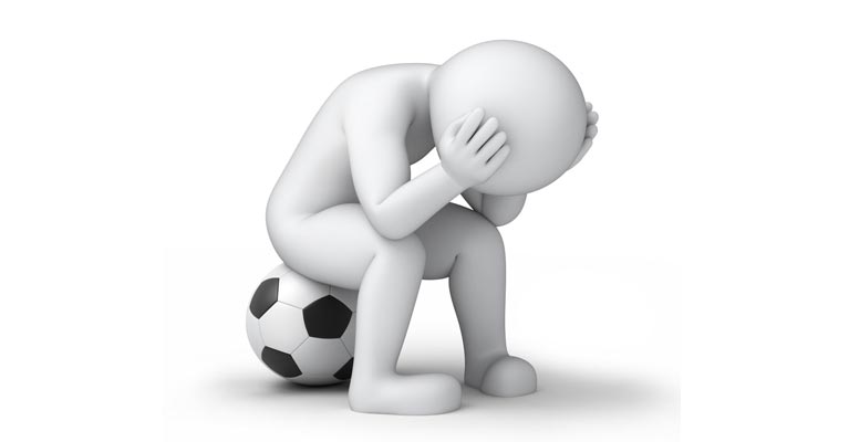Soccer character slumping on a football