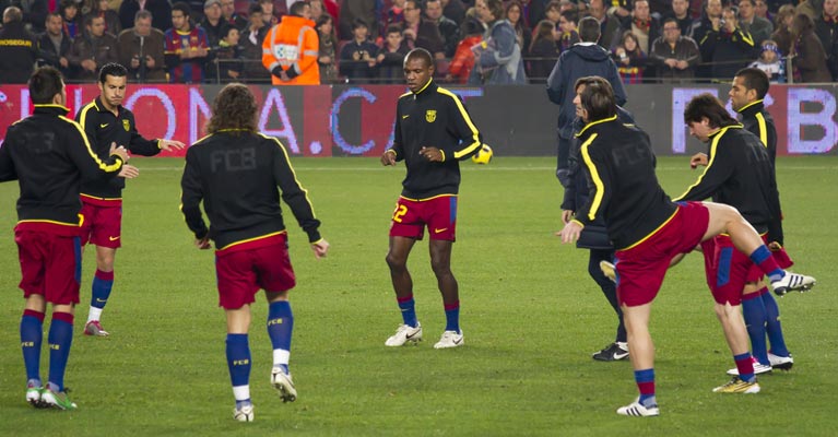 Professional football team warming up for a game