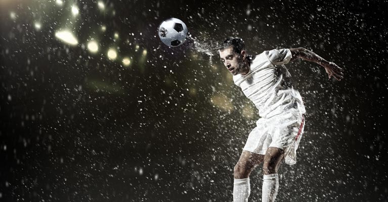 Footballer heading the ball