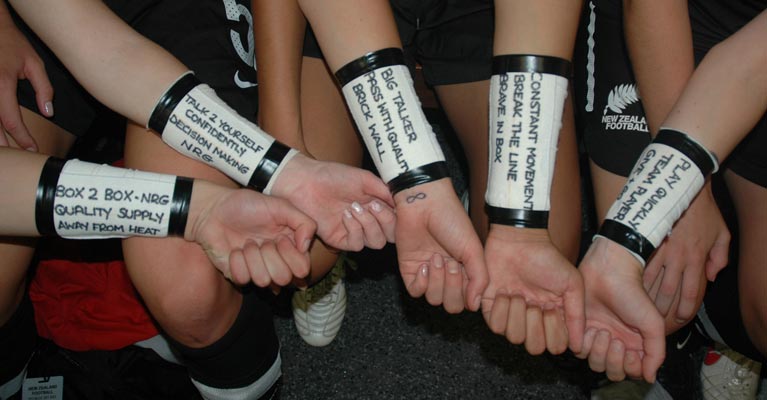 Women's Football Team with Dan Abrahams Script on their arms